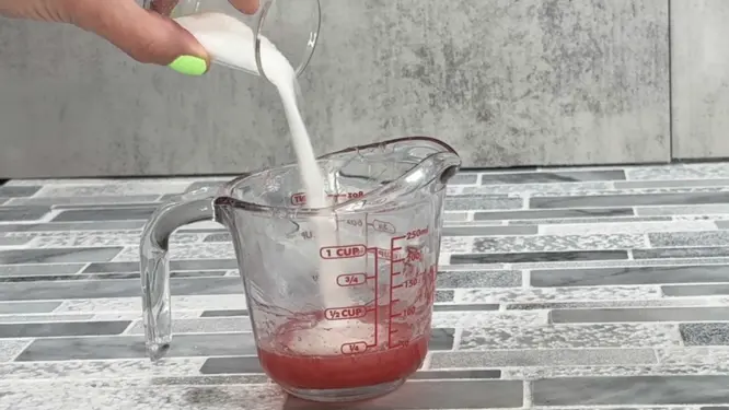 adding sugar to melted soap base for a sugar scrub