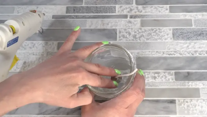 attaching candle wick to jar