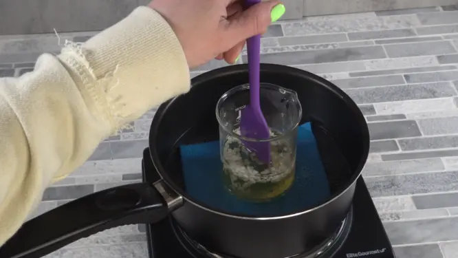 cocoa butter mango butter and beeswax melting in double boiler