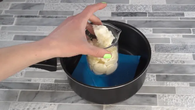 cocoa butter mango butter and beeswax placing in double boiler