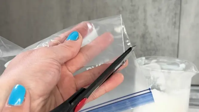 cutting baggie to put lotion into it because it is too thick to bottle