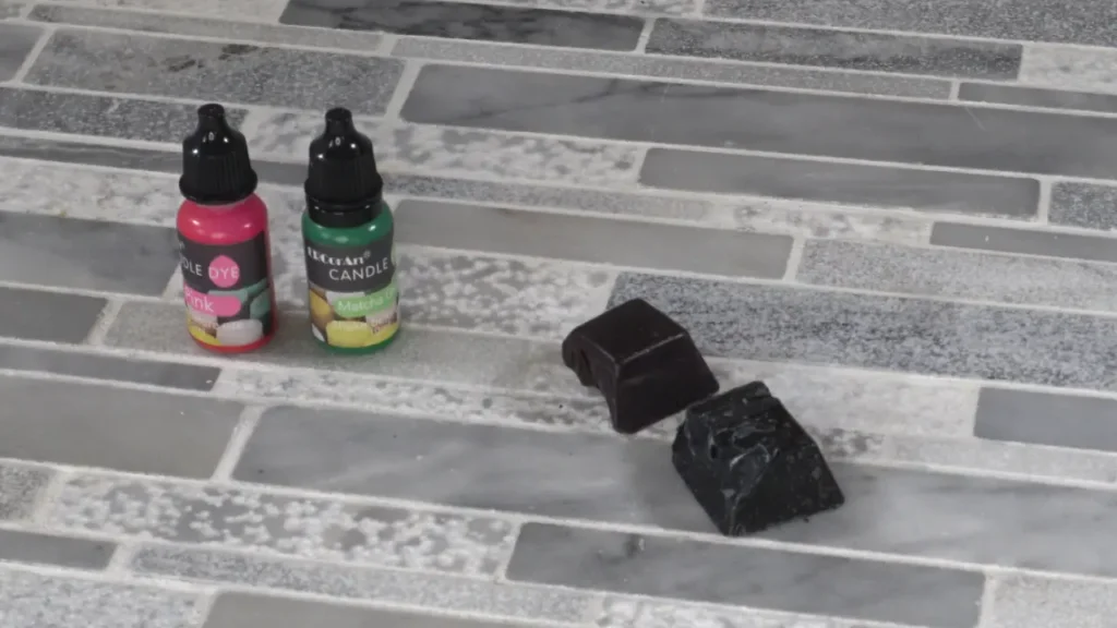 Comparison of candle colorants showing liquid dye versus solid wax color blocks