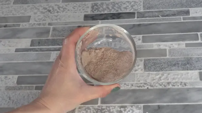 dark brown dry shampoo mixture showing richer cocoa color