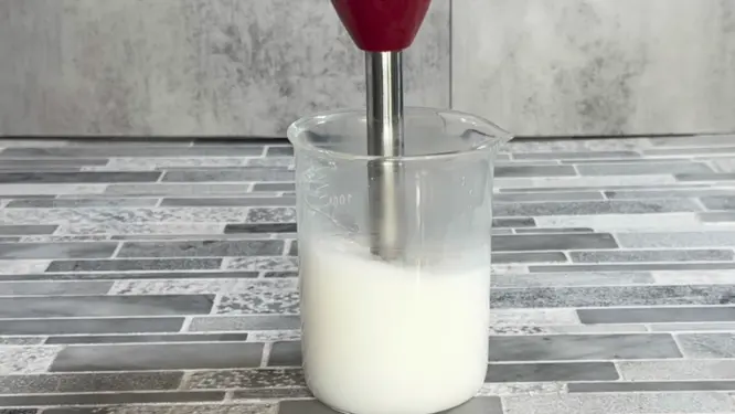 mixing emulsified body butter with immersion blender