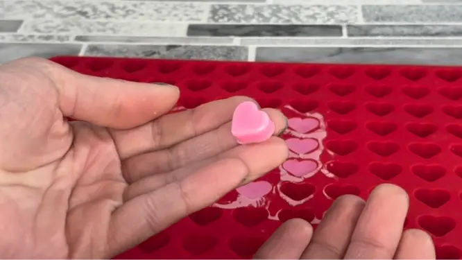 pink and red heart candle embeds removed from mold