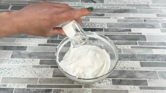 placing cool down ingredients in whipped soap