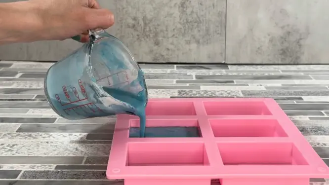 pouring melt and pour soap into silicone mold