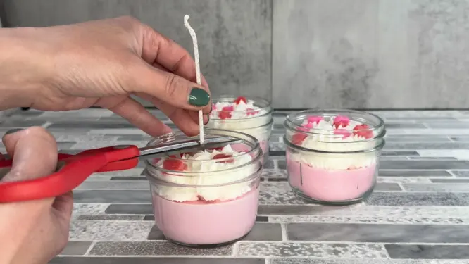 trimming wick finished whipped candle with heart embeds in mason jar