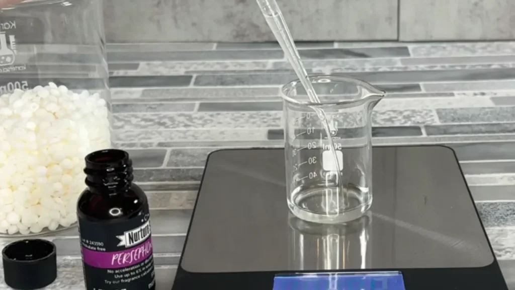 weighing fragrance oil for candle making