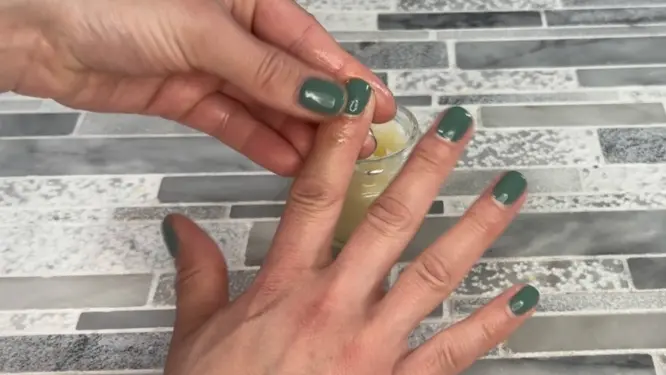 Applying diy cuticle balm to cuticles