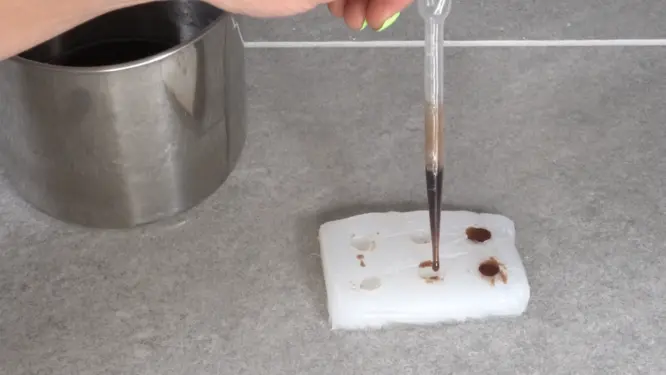 Filling coffee bean mold with a pipette