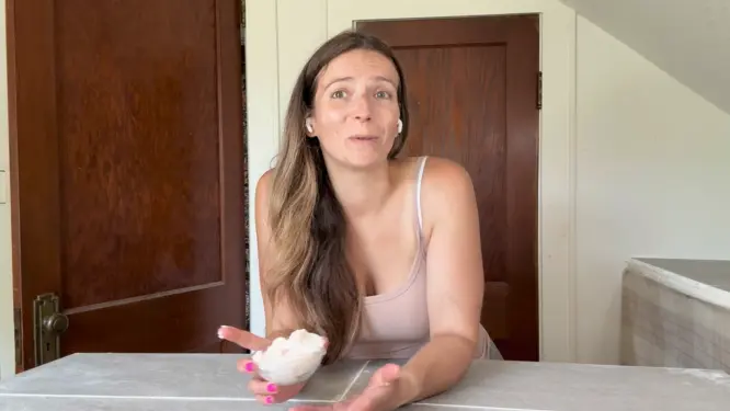Jami from summer rain holding body butter in new studio