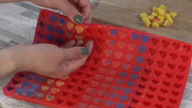 Removing heart-shaped lotion dots from silicone mold