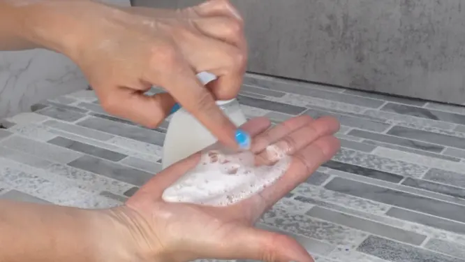 Showing the final bubbly consistency of hand soap