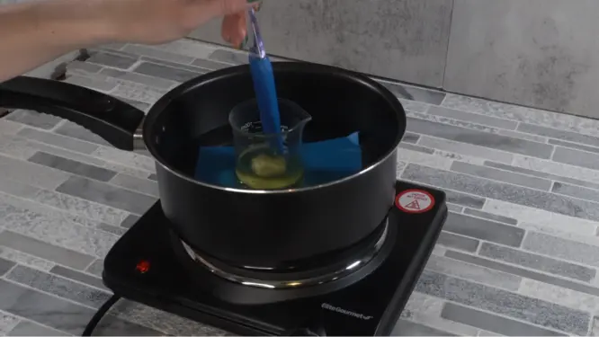 mixing the heat phase ingredients on the double boiler so they do not over heat