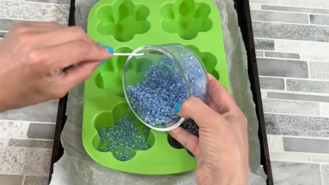 pouring freshies beads into silicone mold
