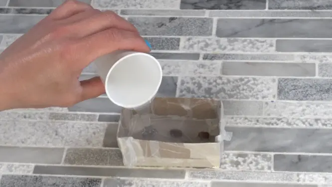 pouring silicone over coffee beans