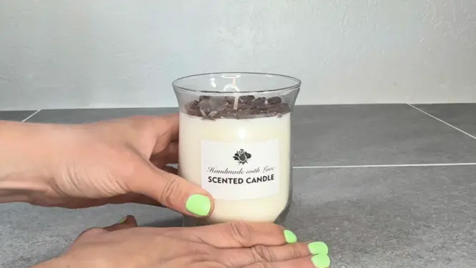putting a label on handmade candle