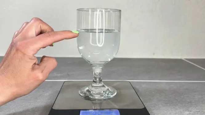 weighing water in cup to see how much wax you need to fill it