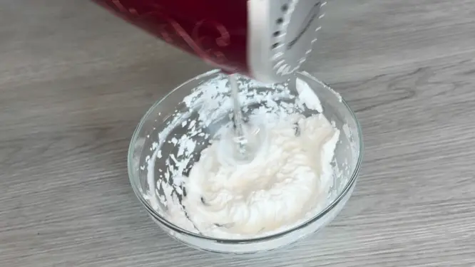 Foaming bath butter being whipped light and fluffy with a hand mixer