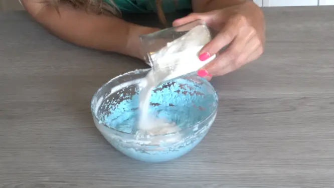 adding sugar to whipped sugar scrub