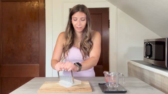 cutting melt and pour soap for a massage soap on a rope