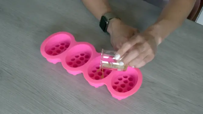 pouring mica into empty silicone mold