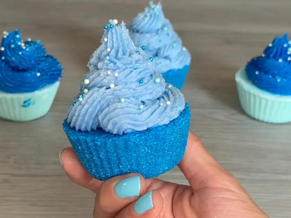 Showing the texture and color of finished bath bomb with pipped frosting