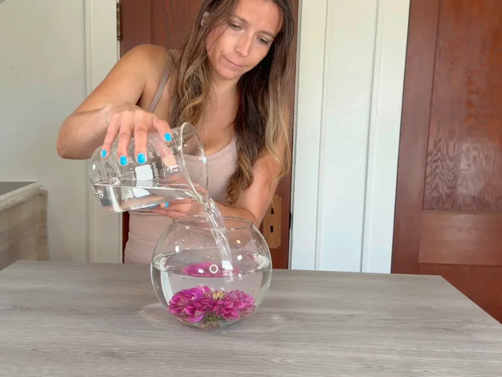 Vase filled with water and flower secured