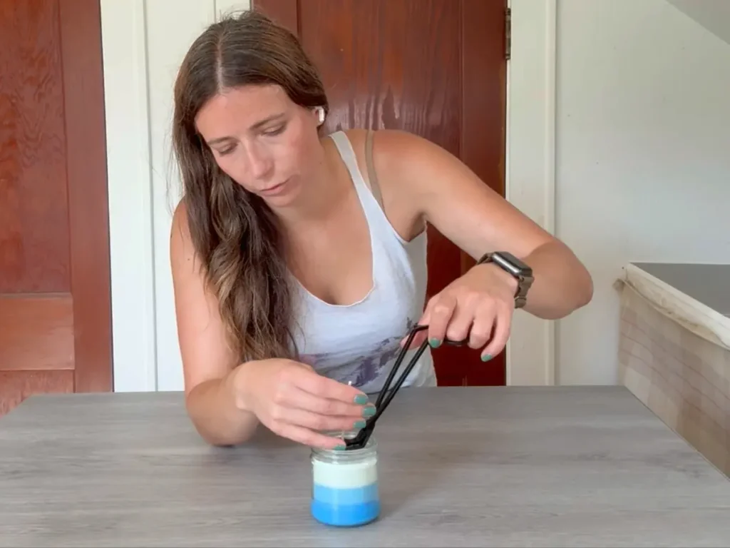 trimming the wick for layered candle