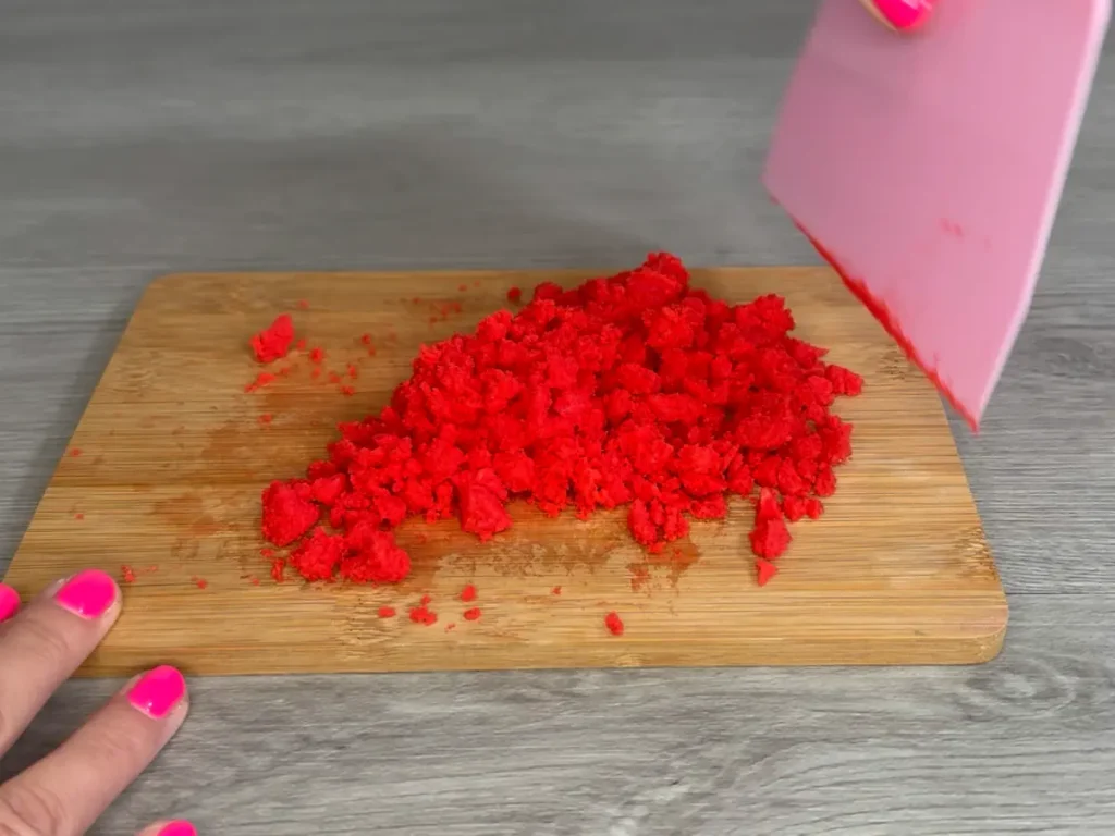 using scraper to make wax crumbles