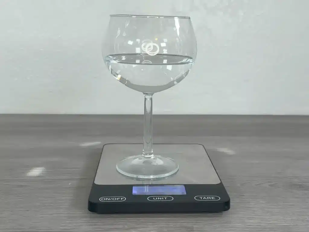 water in candle container to determine how much wax is needed