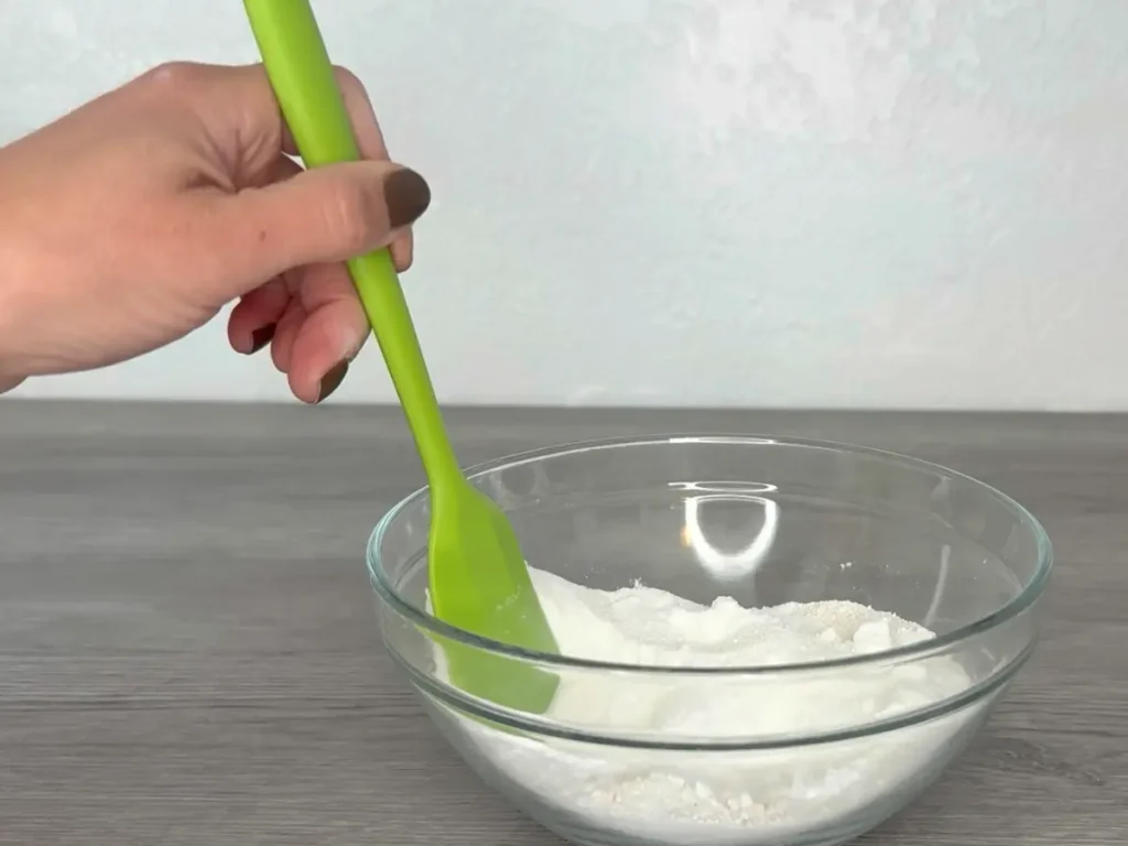 mixing shower steamer dry ingredients in a bowl
