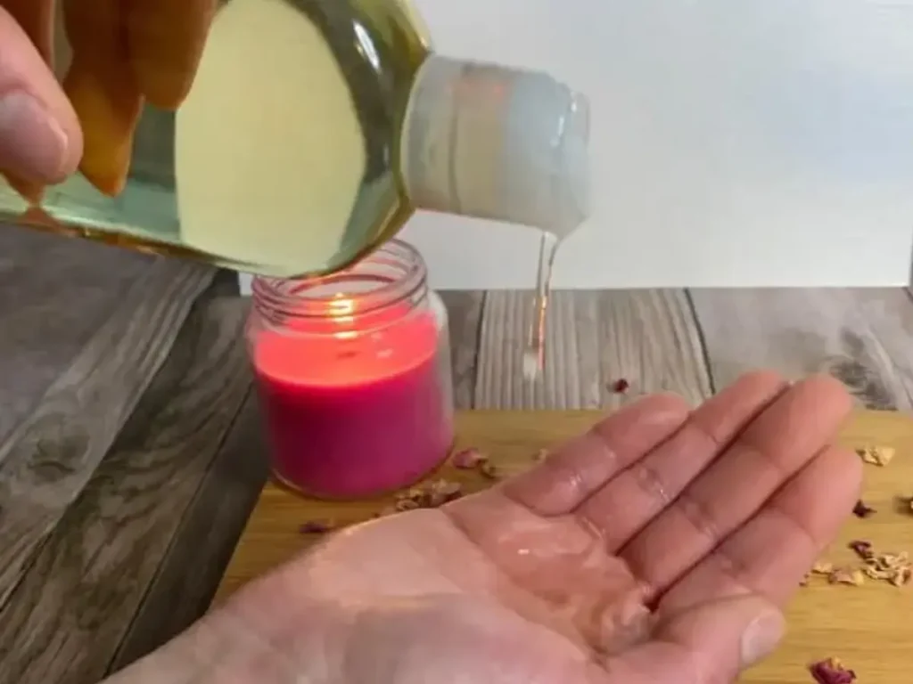 putting massage oil on hand