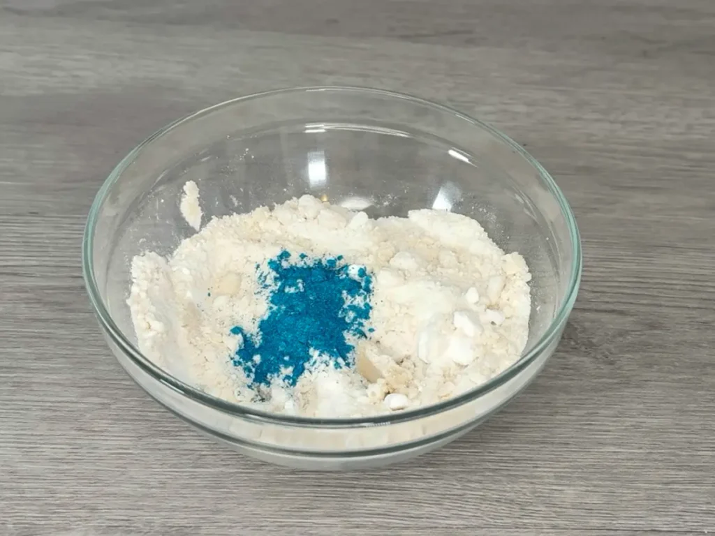putting mica powder into shower steamer powder mix