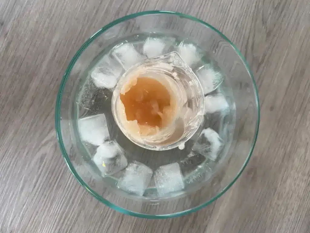 rapidly cooling body butter in an ice bath to prevent graininess