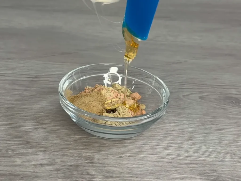 raw honey adding to clay face mask