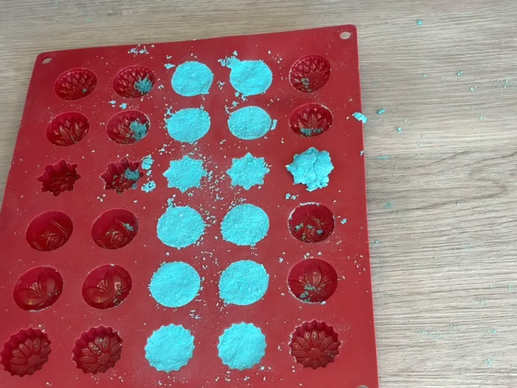 showing shower steamer that is too wet, it overflows out of the mold